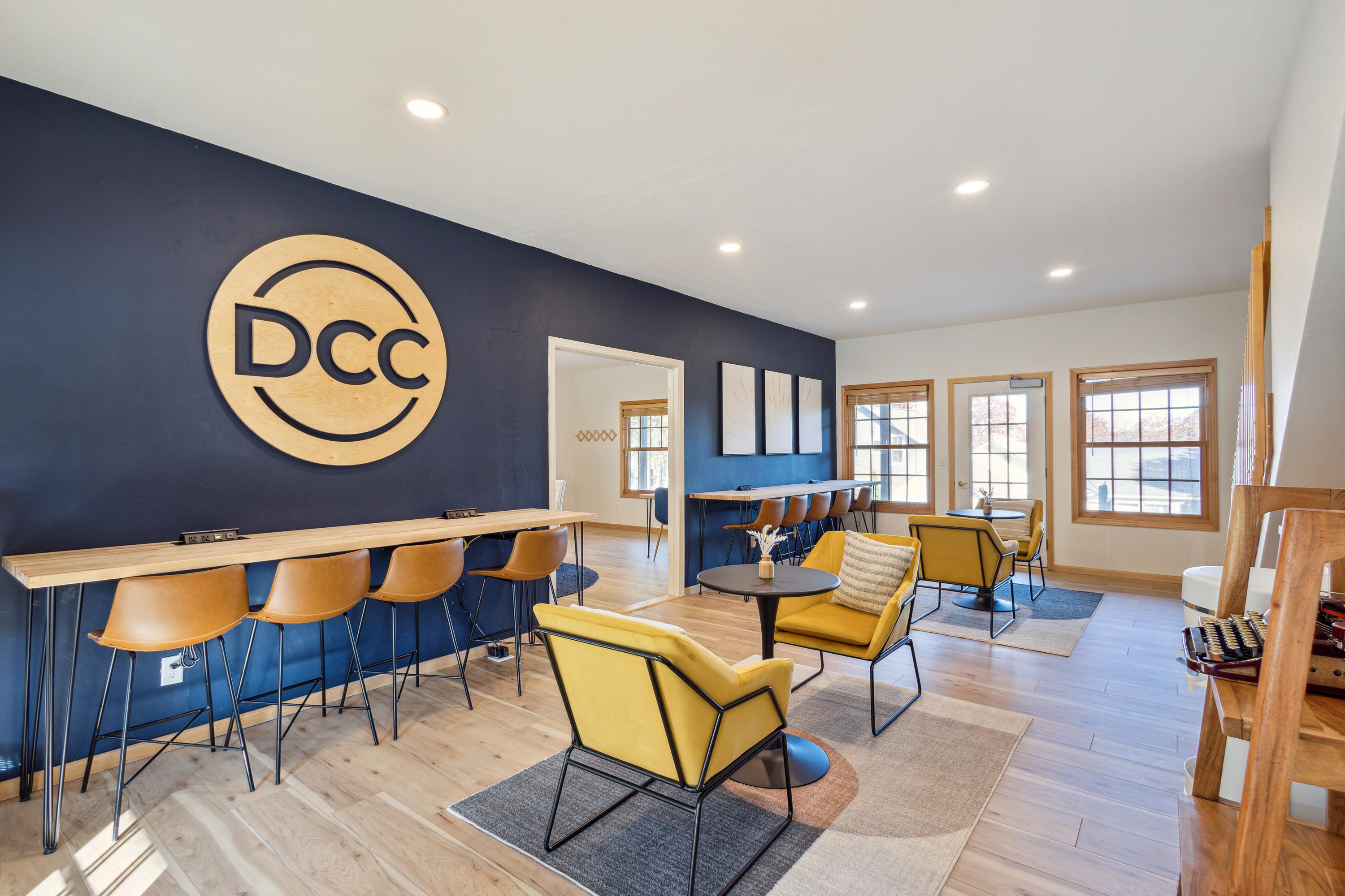 Open coworking space with bar seating and DCC wall mark